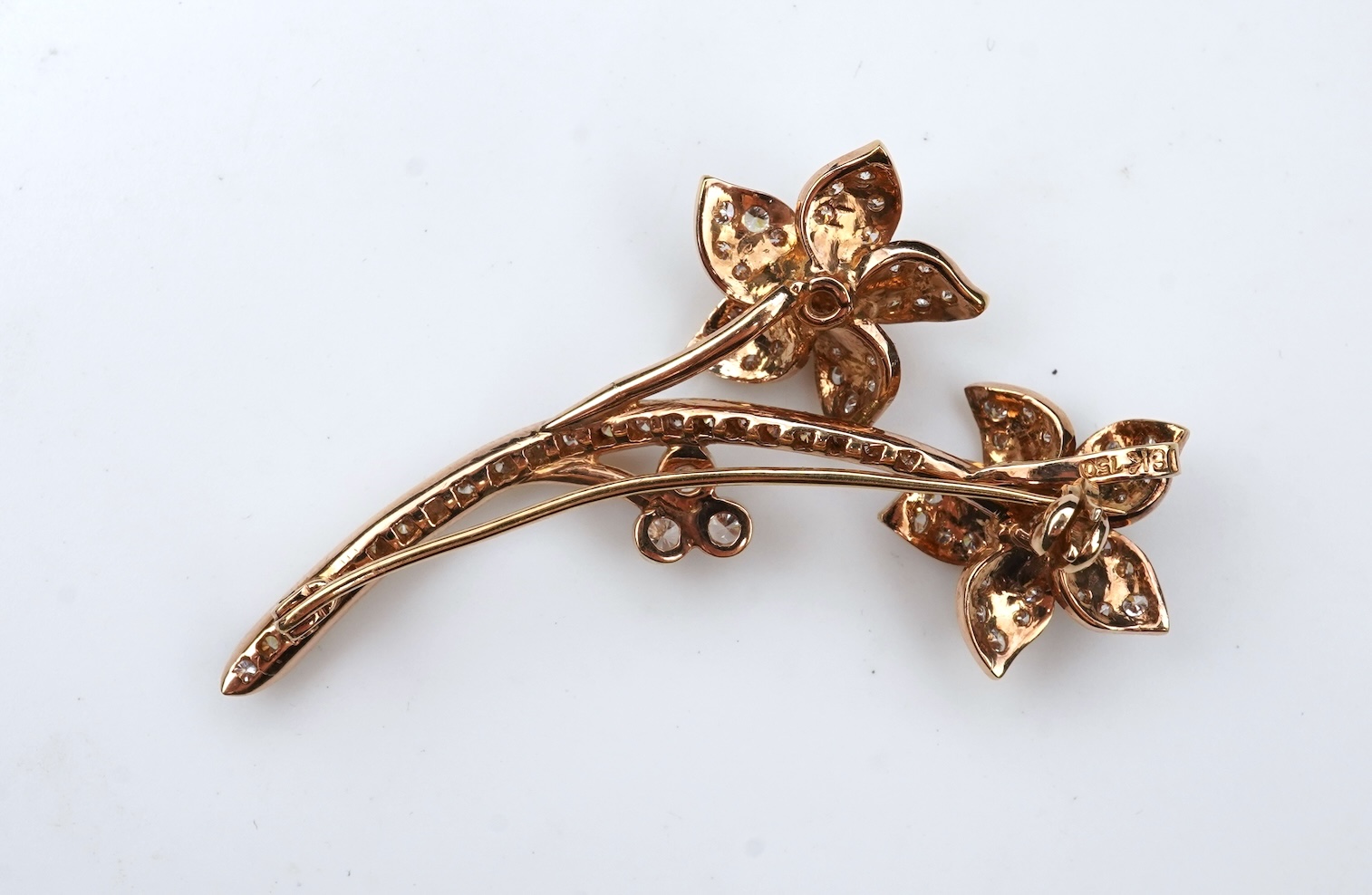 A gold and diamond brooch